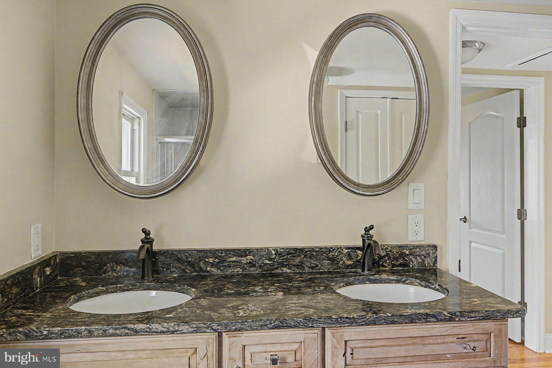 1856 Ringing Rocks Road Upper Black Eddy, PA 18972 - Photo 41 of 49 Elegant dual-sink bathroom retreat.