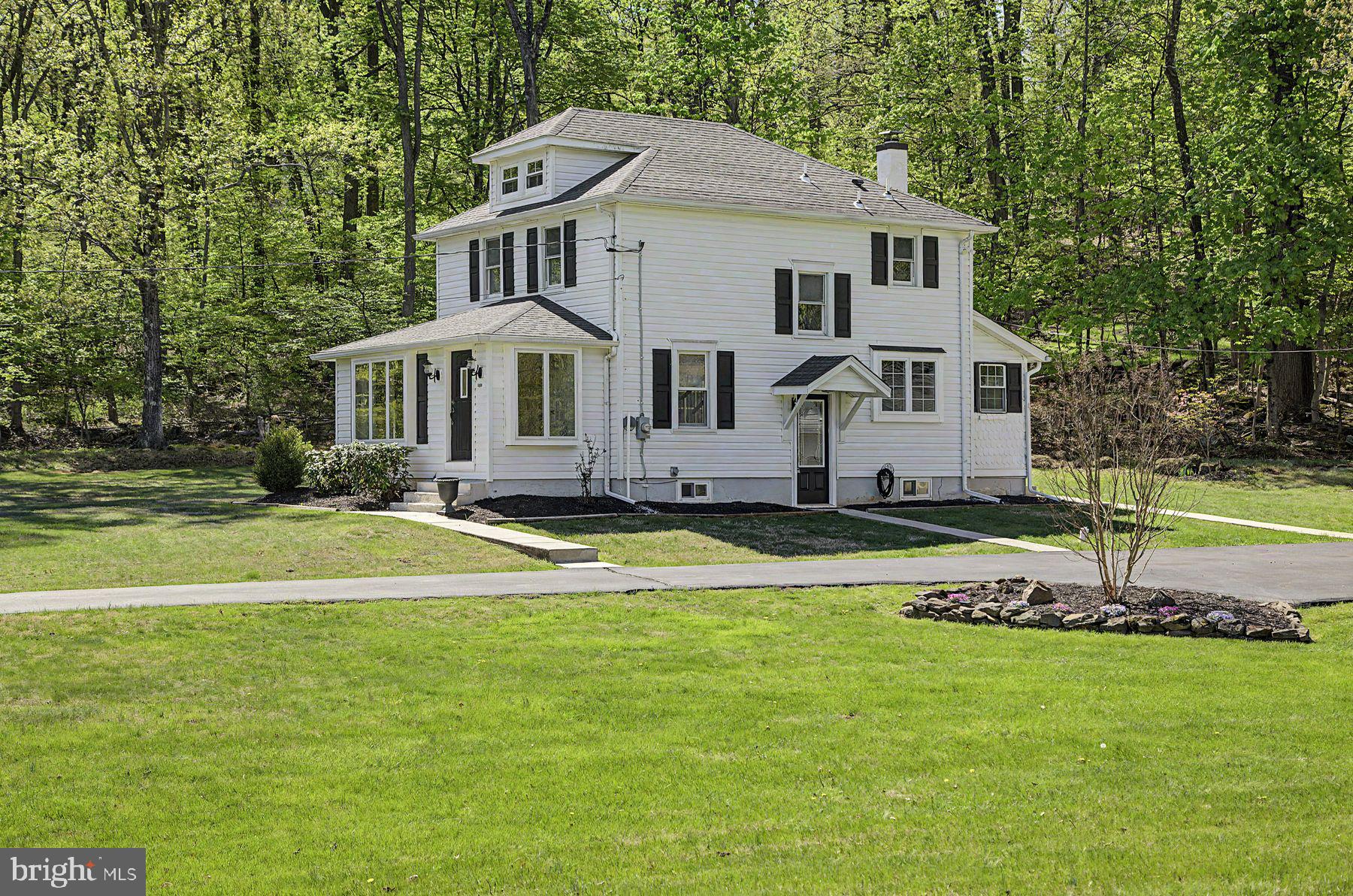 1856 Ringing Rocks Road Upper Black Eddy, PA 18972 - Photo 5 of 49 Charming home nestled in lush greenery.