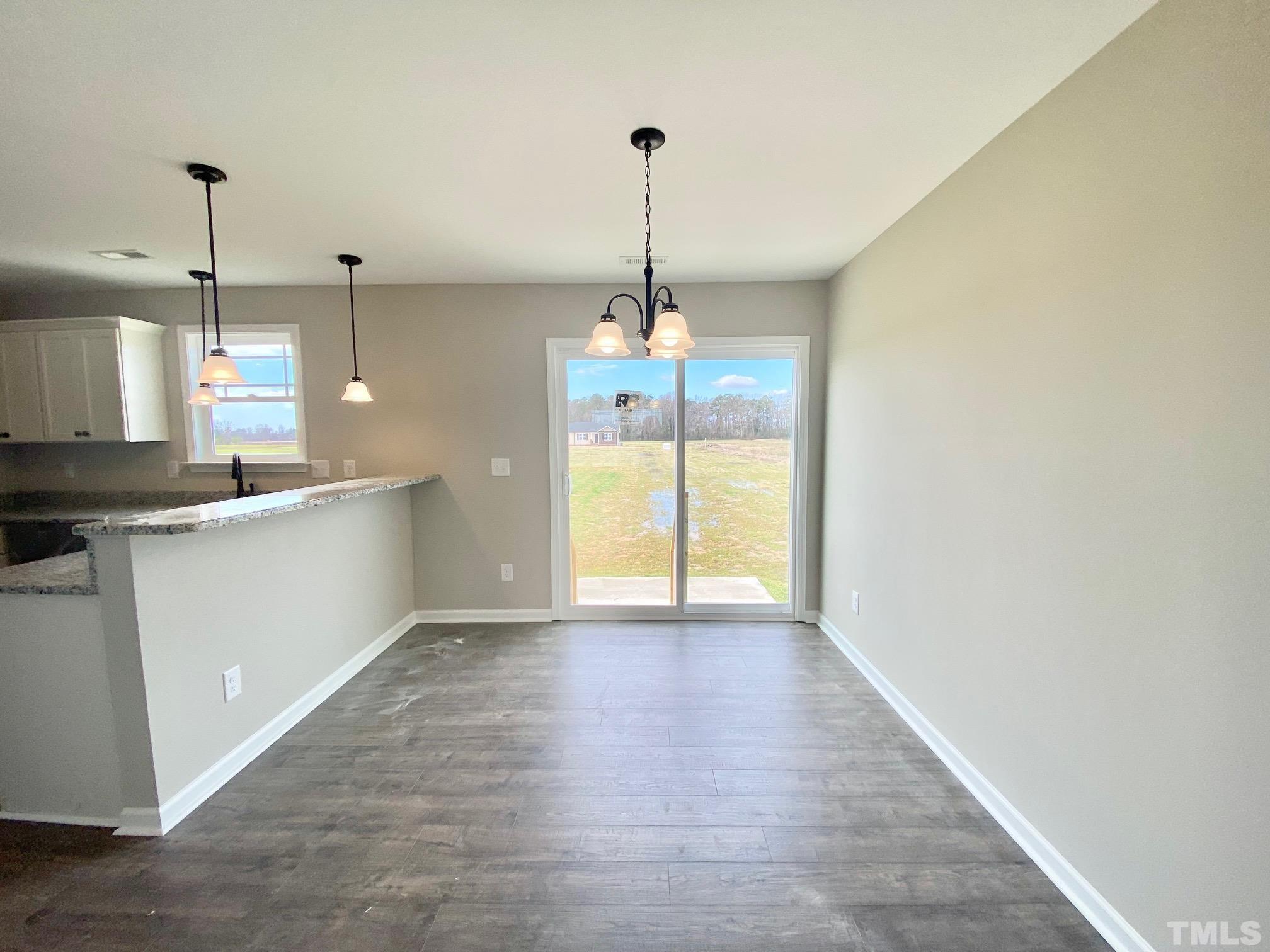 120 Mamie Road Benson, NC 27504 - Photo 11 of 35 a view of a kitchen with a sink and a window