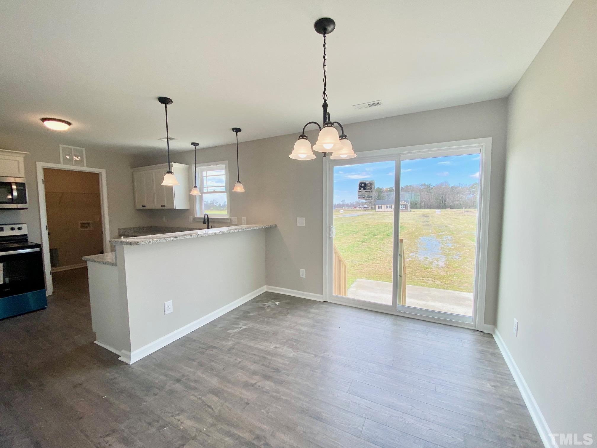 120 Mamie Road Benson, NC 27504 - Photo 12 of 35 a view of a kitchen with a sink and cabinet or chandelier