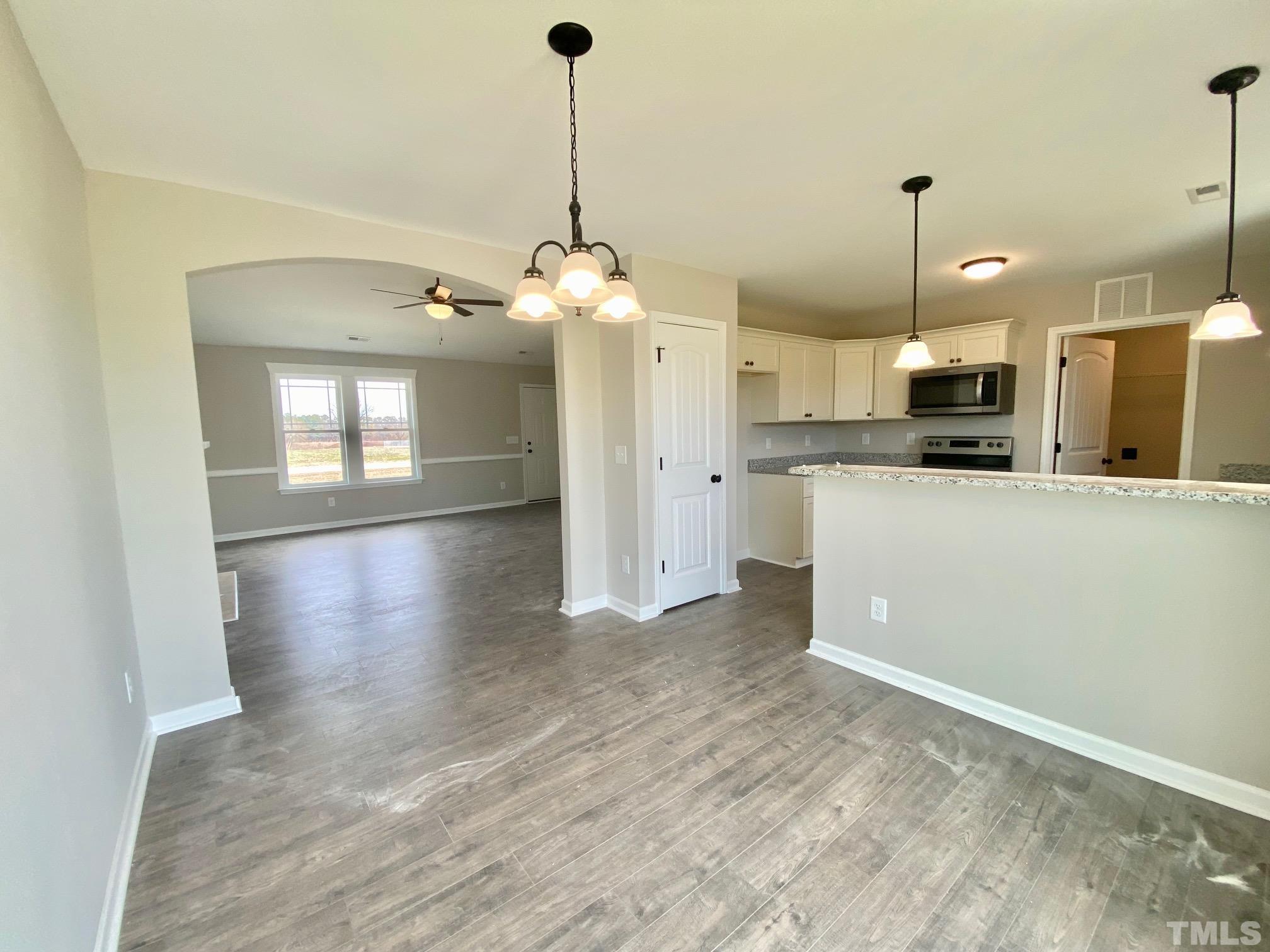 120 Mamie Road Benson, NC 27504 - Photo 13 of 35 a view of a kitchen with a sink and stainless steel appliances