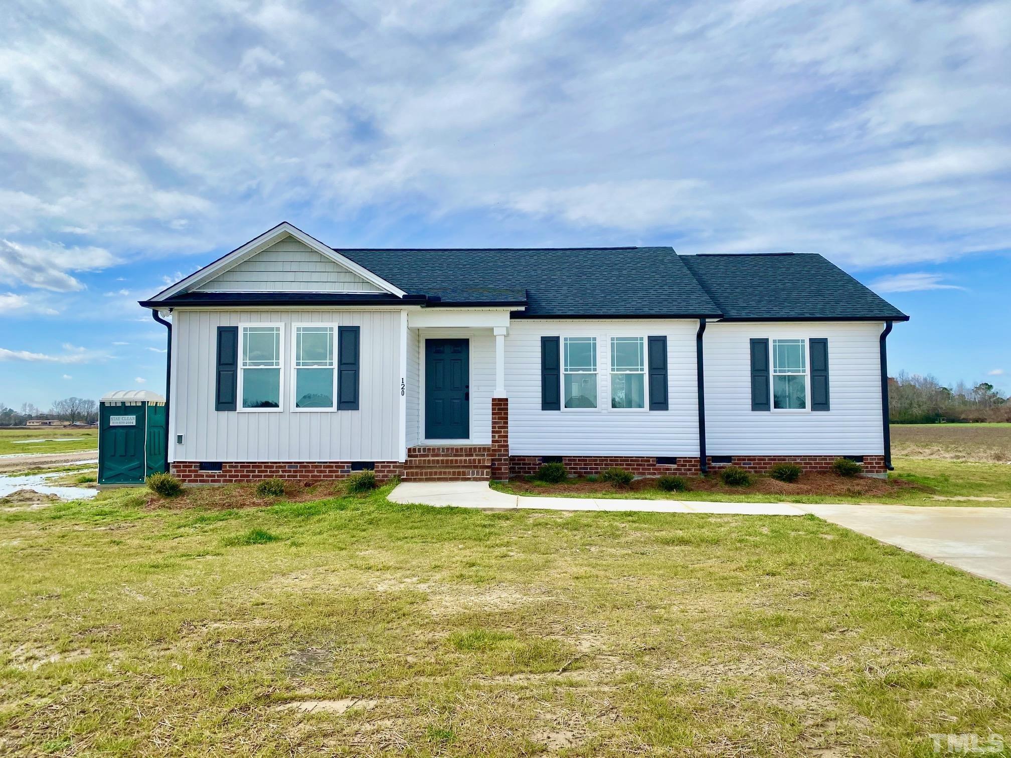 120 Mamie Road Benson, NC 27504 - Photo 2 of 35 a big house with swimming pool in front of it