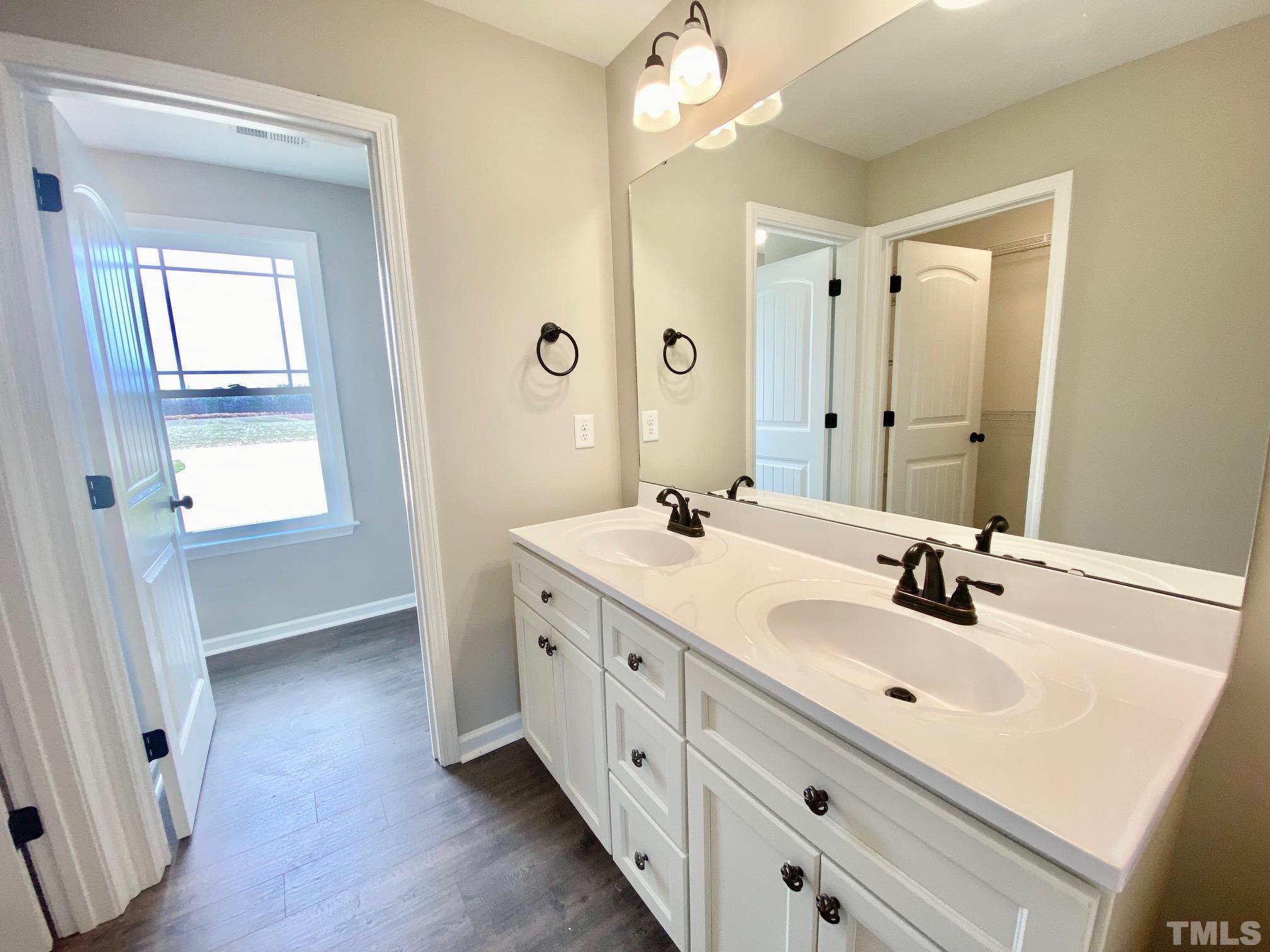 120 Mamie Road Benson, NC 27504 - Photo 24 of 35 a bathroom with 2 sink and a mirror