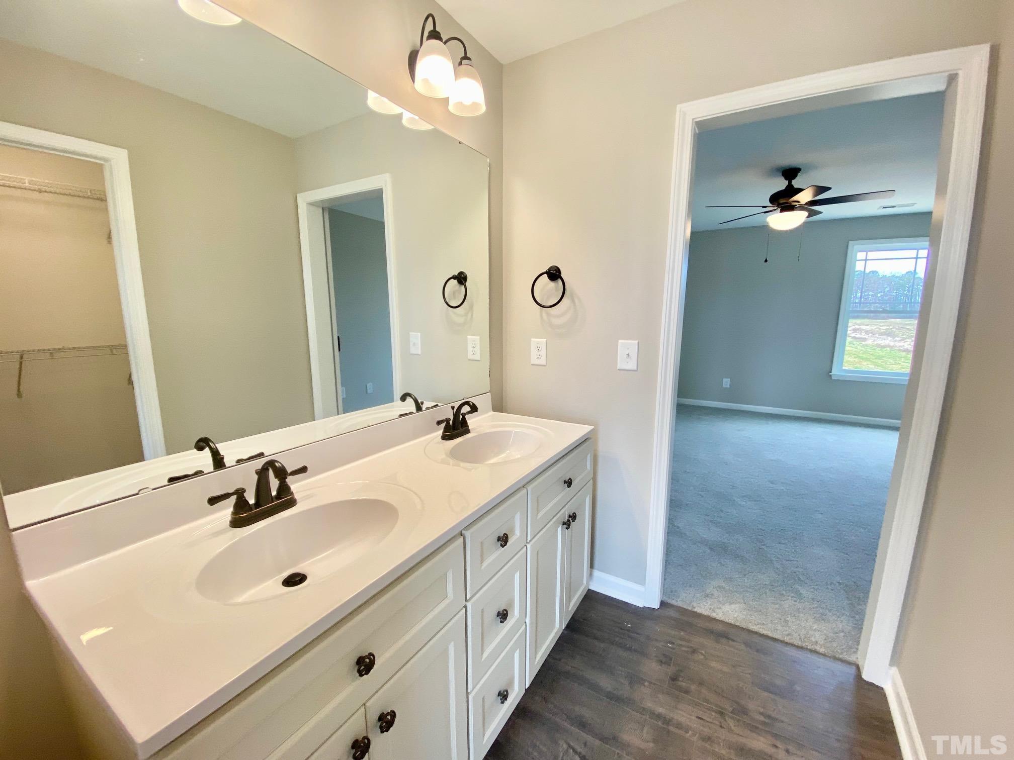 120 Mamie Road Benson, NC 27504 - Photo 26 of 35 a spacious bathroom with a double vanity sink a mirror and shower