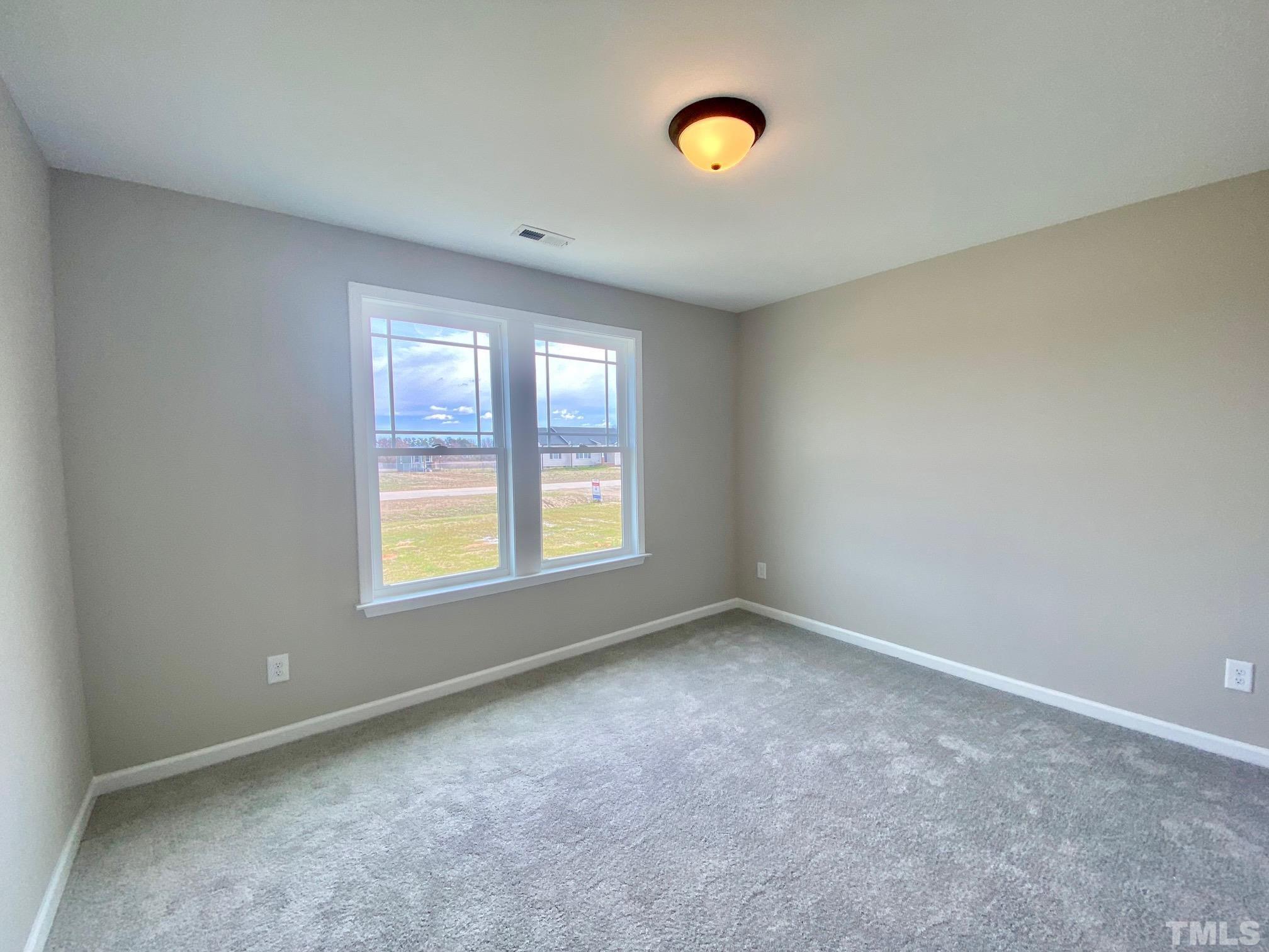 120 Mamie Road Benson, NC 27504 - Photo 28 of 35 an empty room with a window