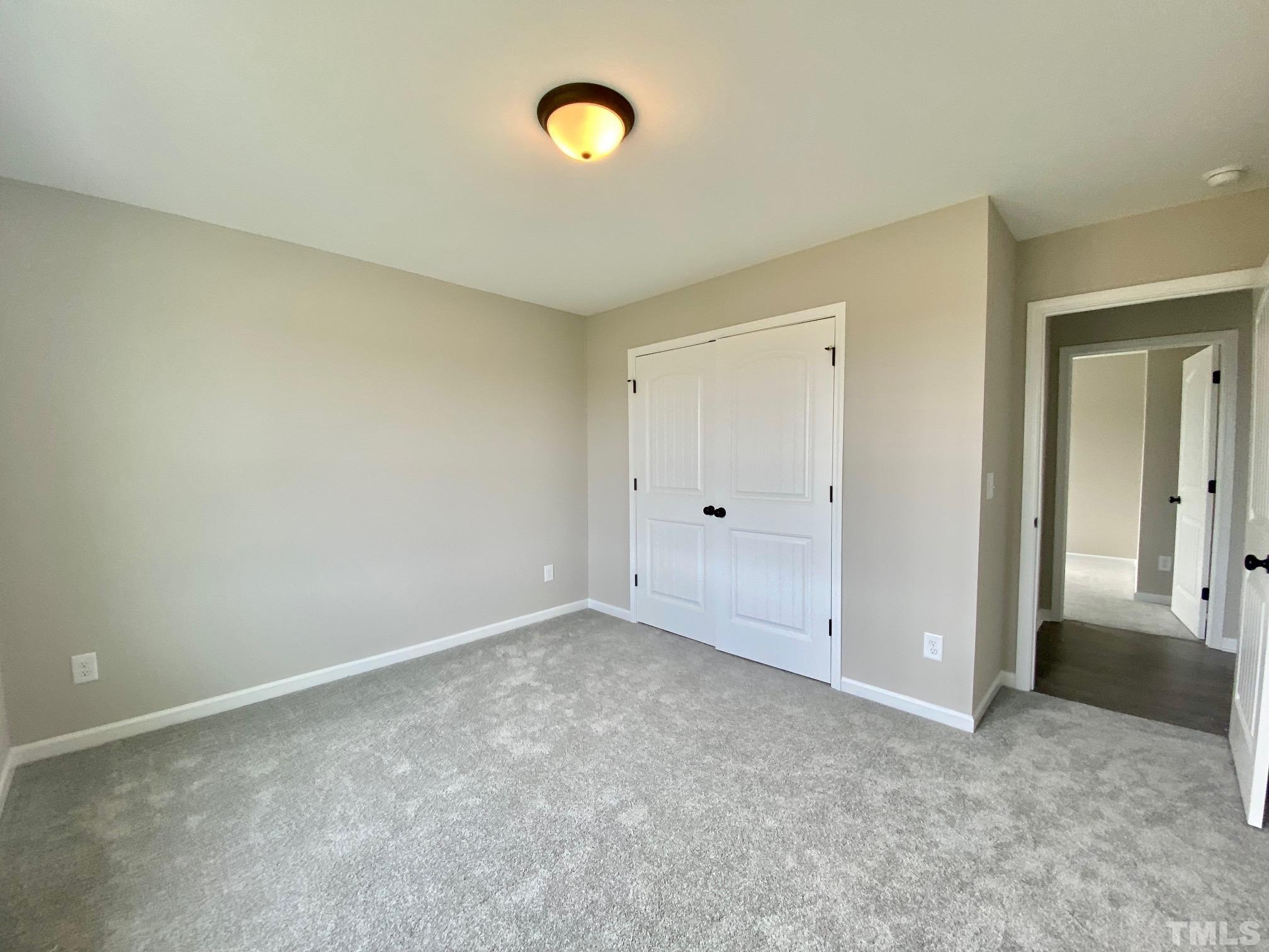 120 Mamie Road Benson, NC 27504 - Photo 29 of 35 an empty room with windows and entrance