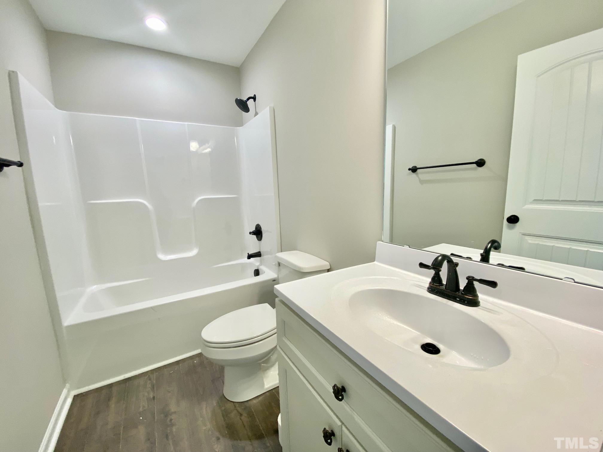 120 Mamie Road Benson, NC 27504 - Photo 30 of 35 a bathroom with a sink a toilet and shower