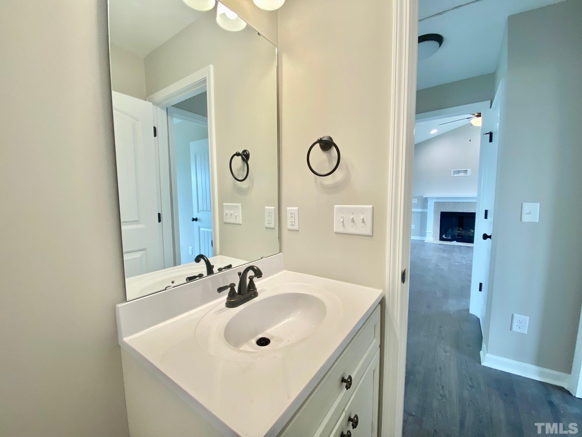 120 Mamie Road Benson, NC 27504 - Photo 31 of 35 a bathroom with a sink and a mirror