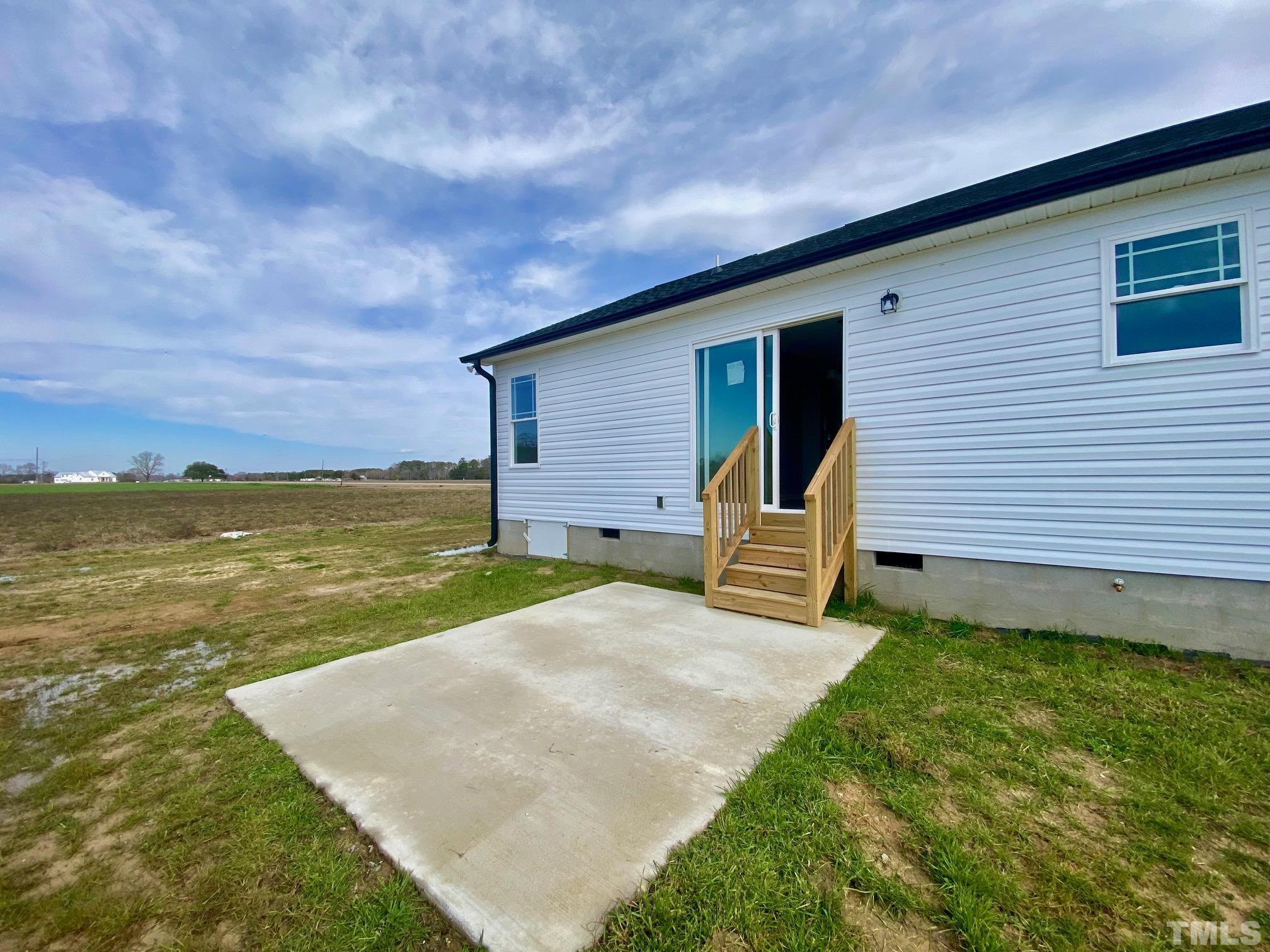120 Mamie Road Benson, NC 27504 - Photo 35 of 35 a view of a house with a backyard