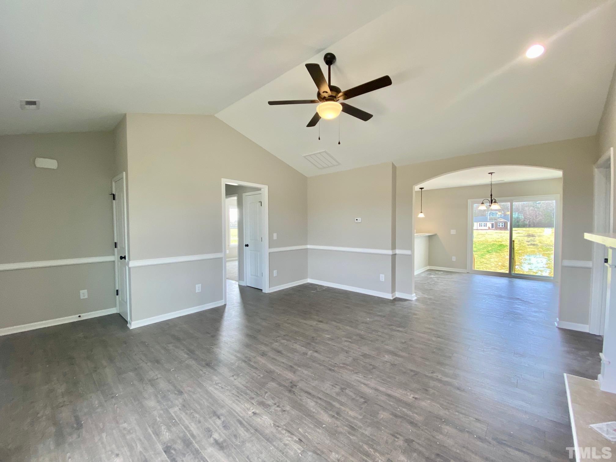 120 Mamie Road Benson, NC 27504 - Photo 7 of 35 an empty room with wooden floor and windows