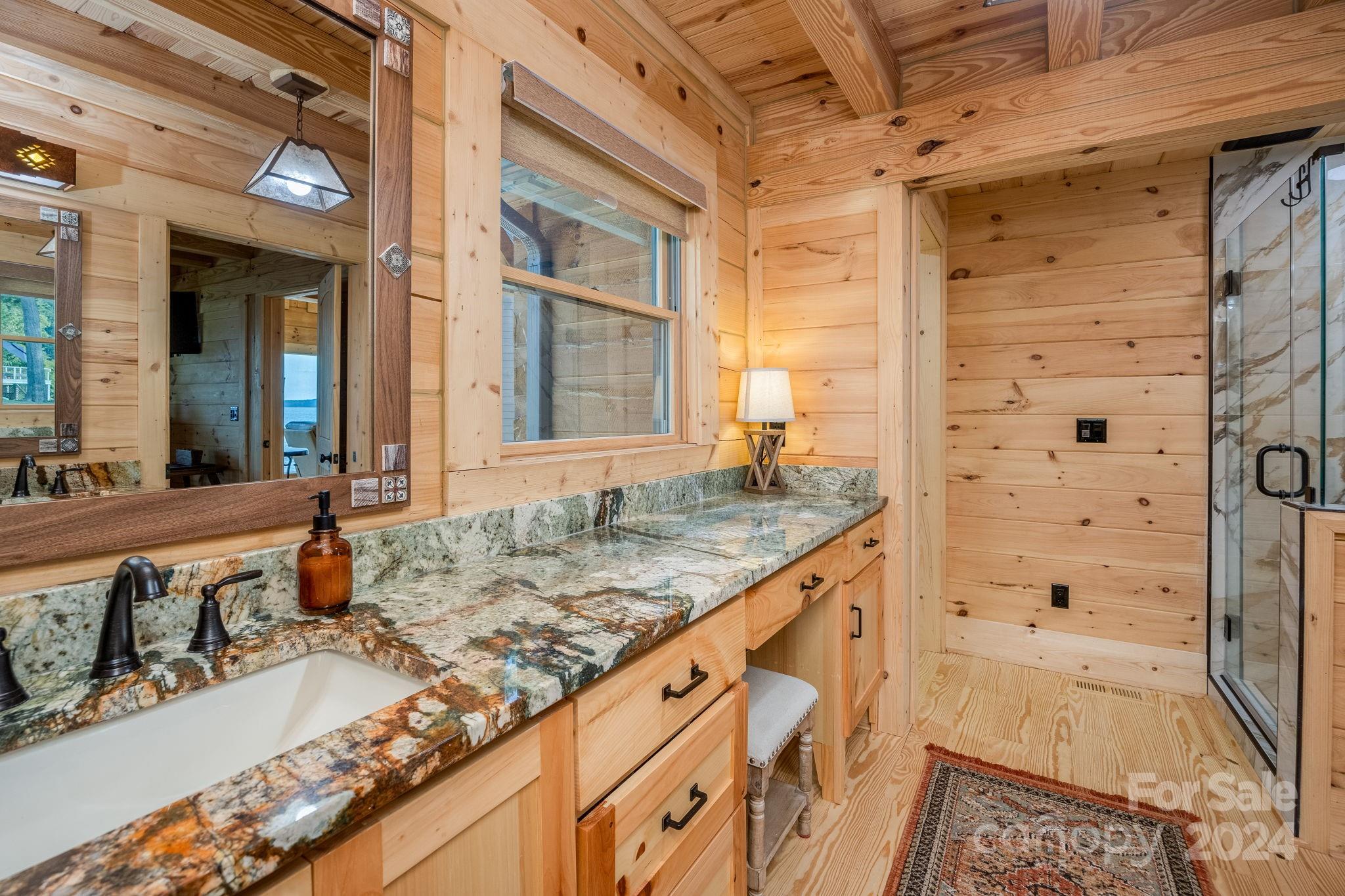 1958 Boxelder Trail Ridgeway, SC 29130 - Photo 22 of 46 a bathroom with a granite countertop sink and a mirror