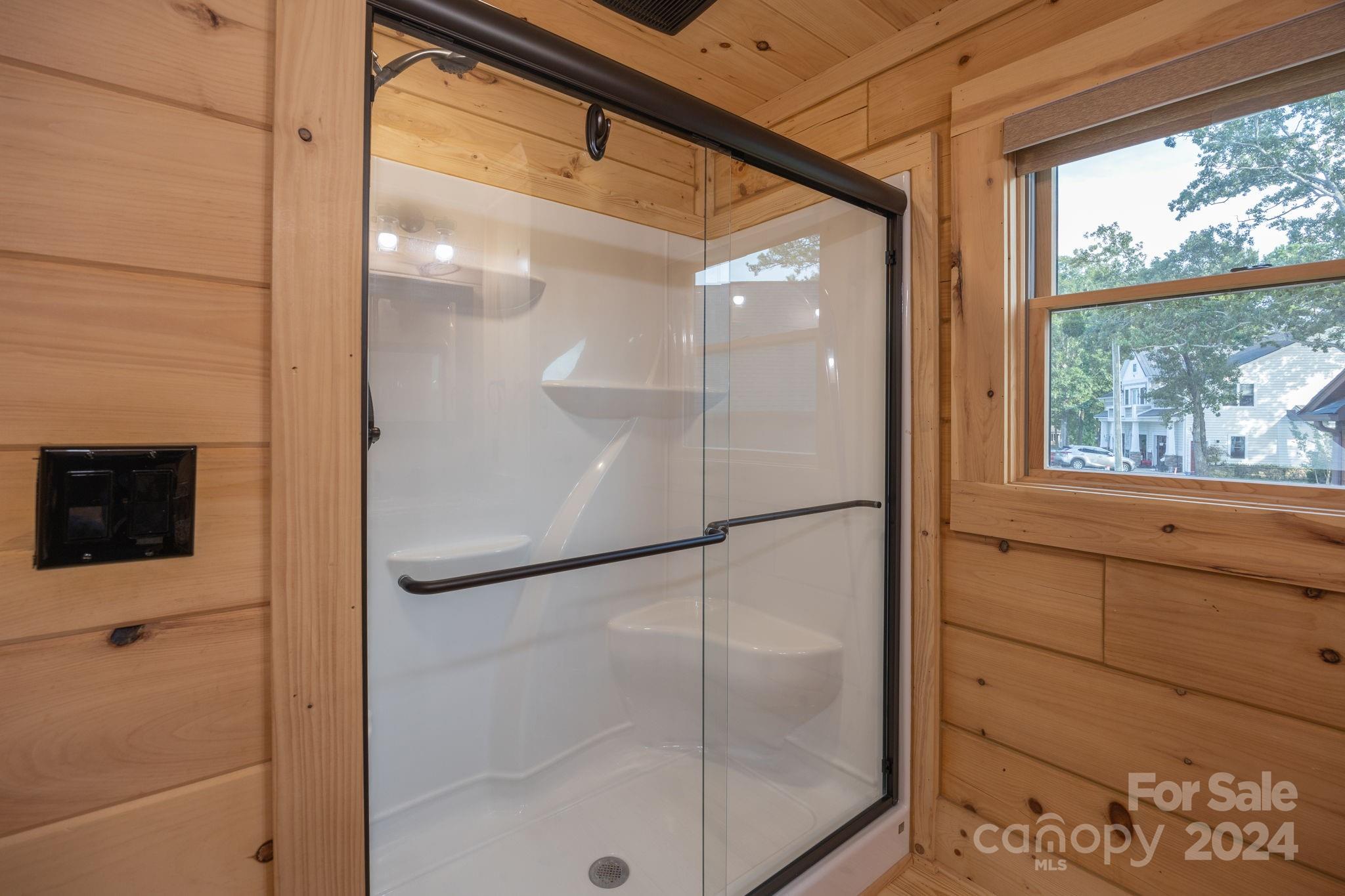 1958 Boxelder Trail Ridgeway, SC 29130 - Photo 30 of 46 a bathroom with a glass shower door and a window