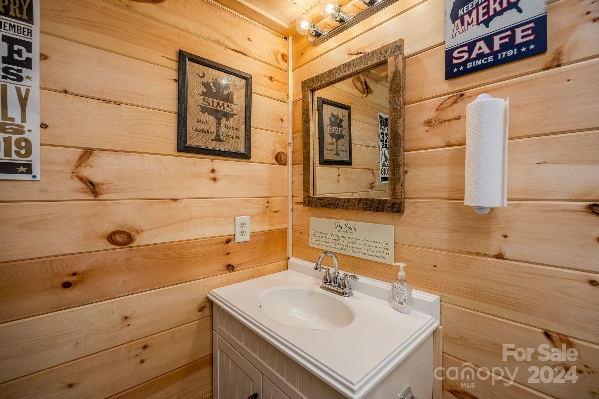 1958 Boxelder Trail Ridgeway, SC 29130 - Photo 33 of 46 a bathroom with a sink and a mirror