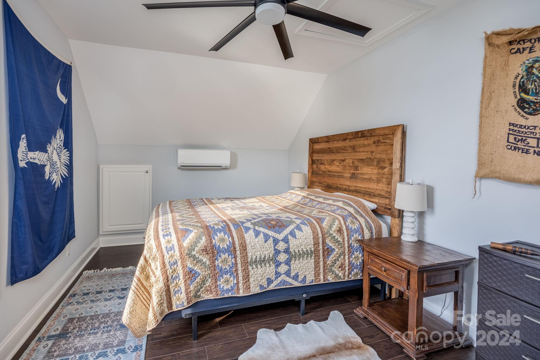 1958 Boxelder Trail Ridgeway, SC 29130 - Photo 43 of 46 a bedroom with a bed wooden floor and lamp