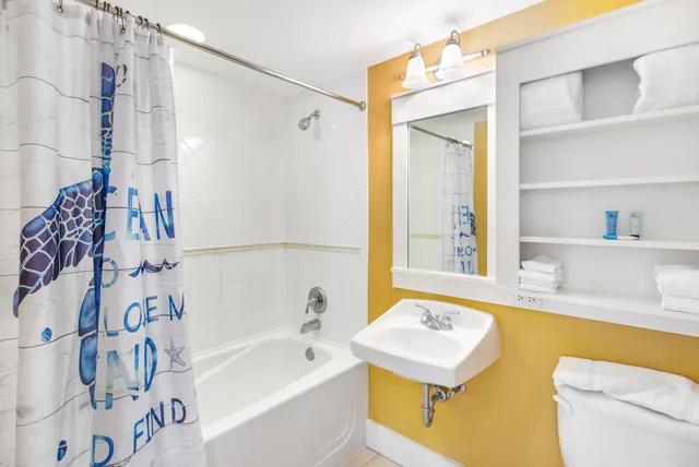 a bathroom with a sink a bathtub and a shower