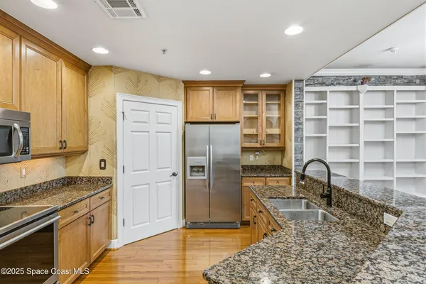 a view of kitchen with cabinets and outdoor space