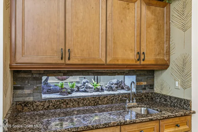 a bathroom with a sink a vanity and a mirror