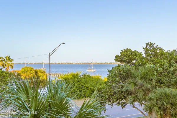 a living room with furniture a dining table and chairs