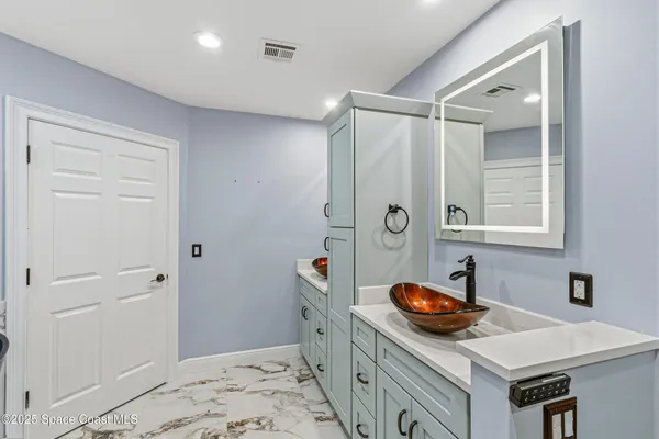 a view of a city street with tall buildings