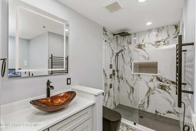 a view of roof deck with table and chairs