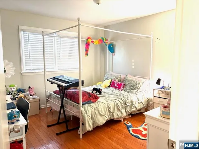 a bed room with a bed and a chair