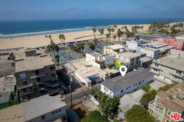 an aerial view of a building with outdoor space