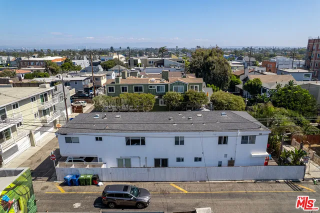 an aerial view of a house with a garden and plants