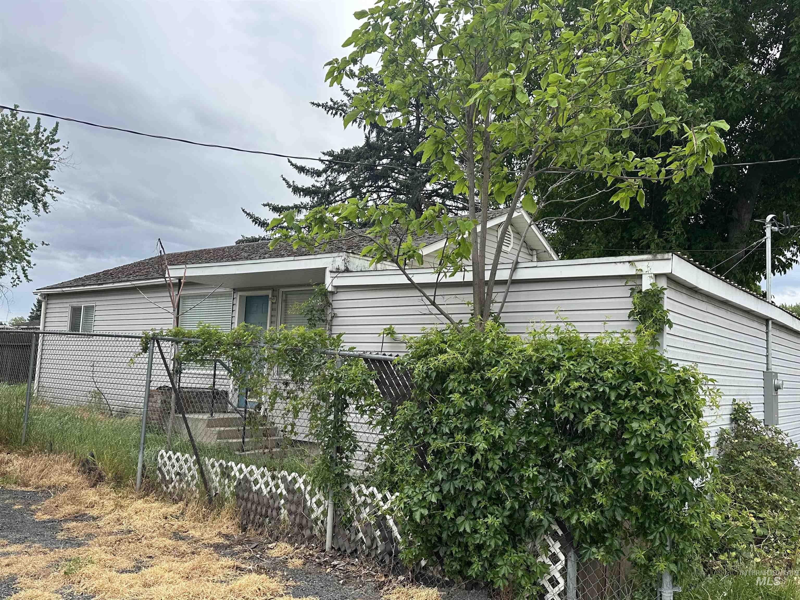 630 Preston Avenue, Unit C Lewiston, ID 83501 - Photo 2 of 10 Single-story residence featuring light-colored horizontal siding and a dark-toned roof