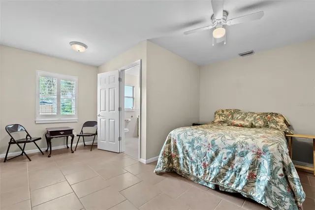 a bedroom with a bed and a table in it