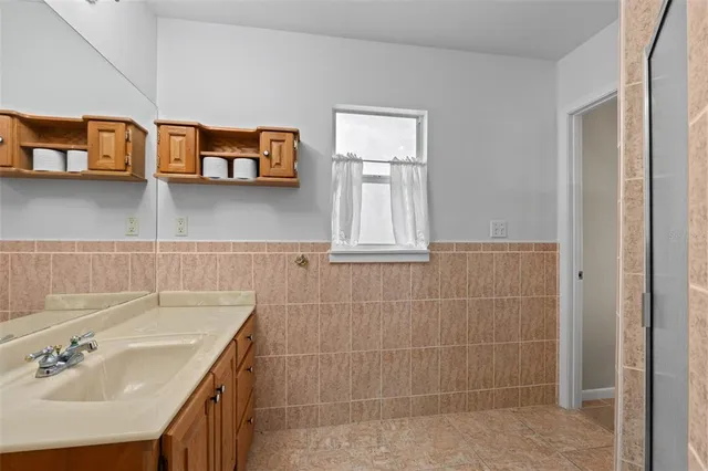 a bathroom with a sink and a mirror