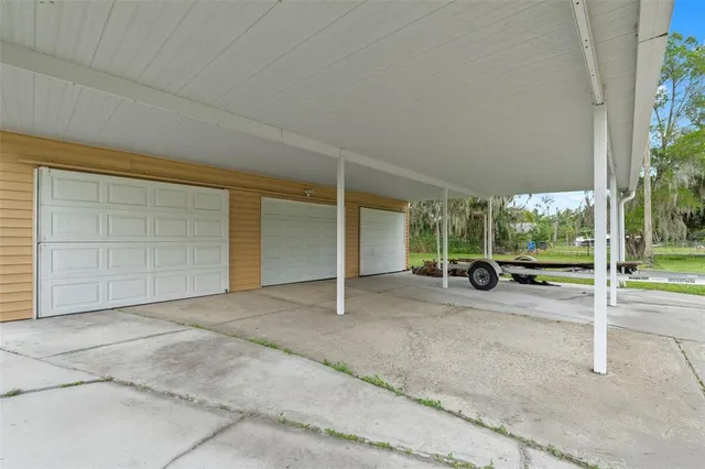 a view of a wooden deck with a lake view