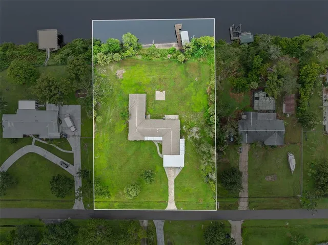 an aerial view of a city with lake view