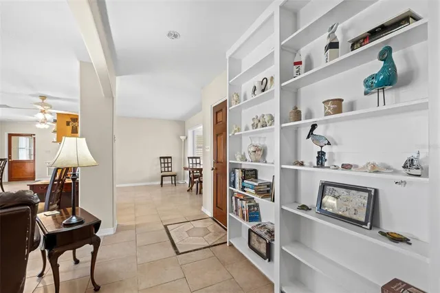 a living room with furniture and white walls