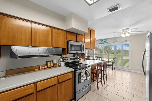 a kitchen with a table chairs and a sink
