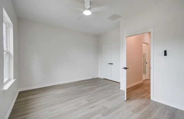 a bathroom with a toilet sink shower and mirror