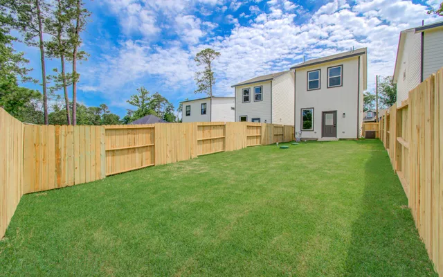 a view of kitchen with wooden floor and electronic appliances