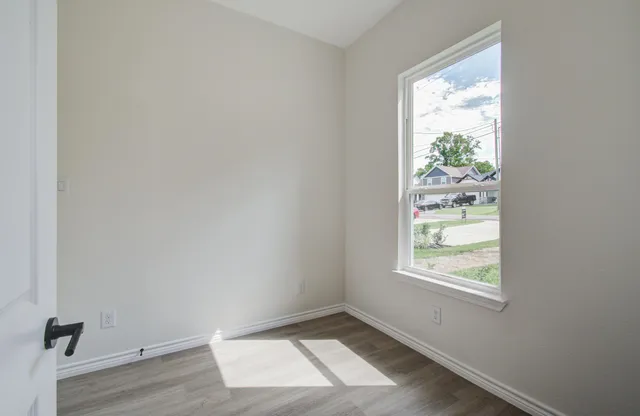 a living room with furniture kitchen and a window