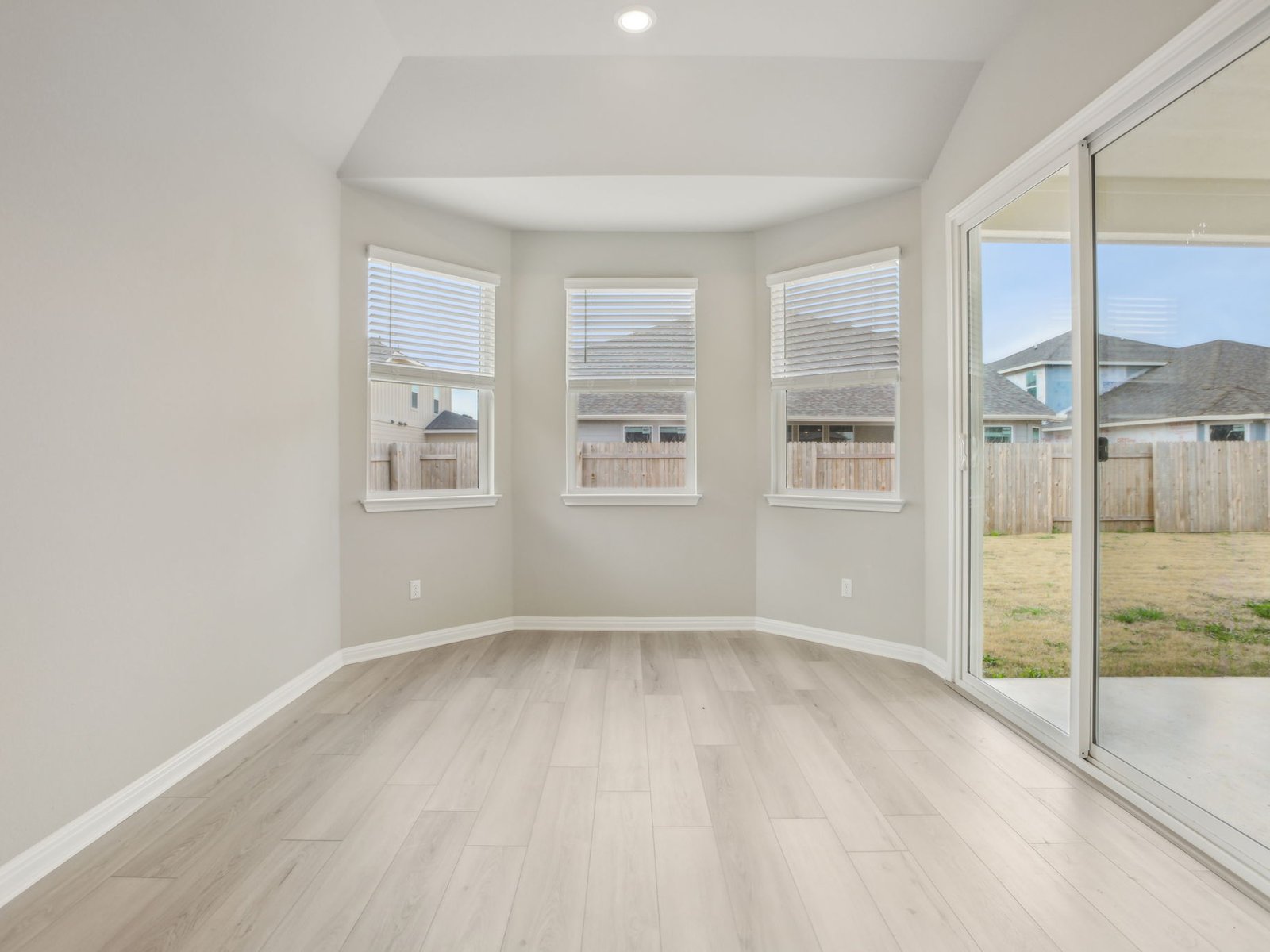 129 Pendleton Drive Kyle, TX 78640 - Photo 5 of 11 an empty room with windows