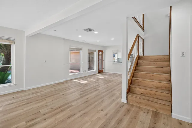 a view of entryway with wooden floor
