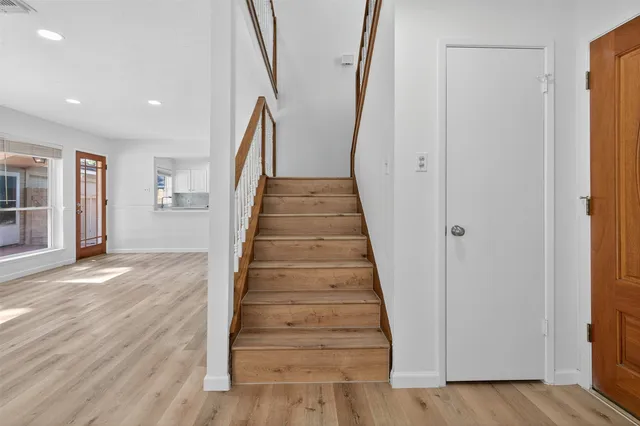 a view of entryway with wooden floor