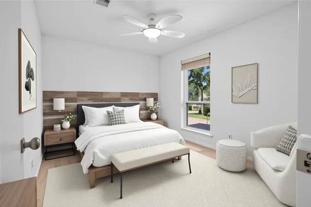 a bedroom with a bed and a table