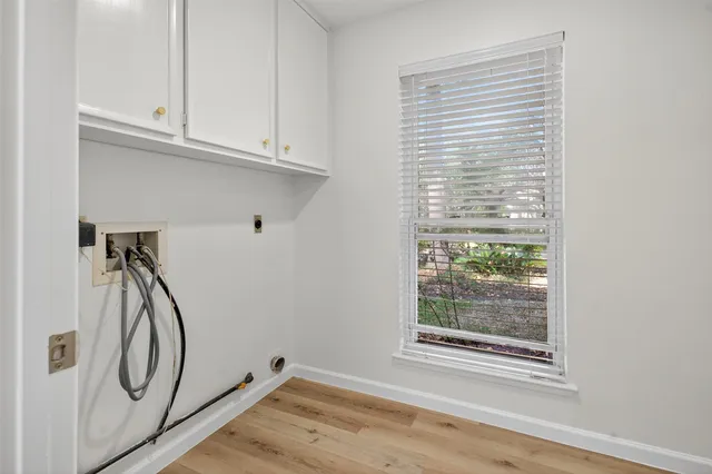 a view of a storage and utility room with washer and dryer