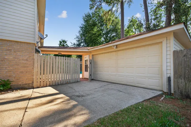 a side view of a house with a garage