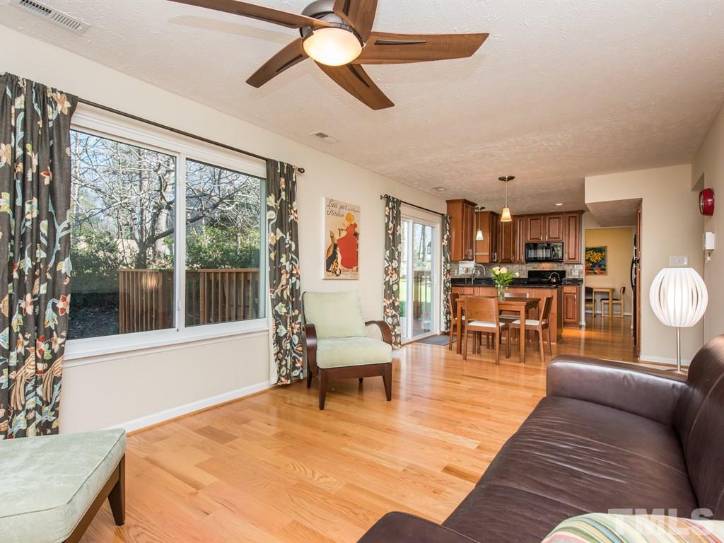 115 Trinity Woods Drive Raleigh, NC 27607 - Photo 11 of 25 a living room with furniture and a large window