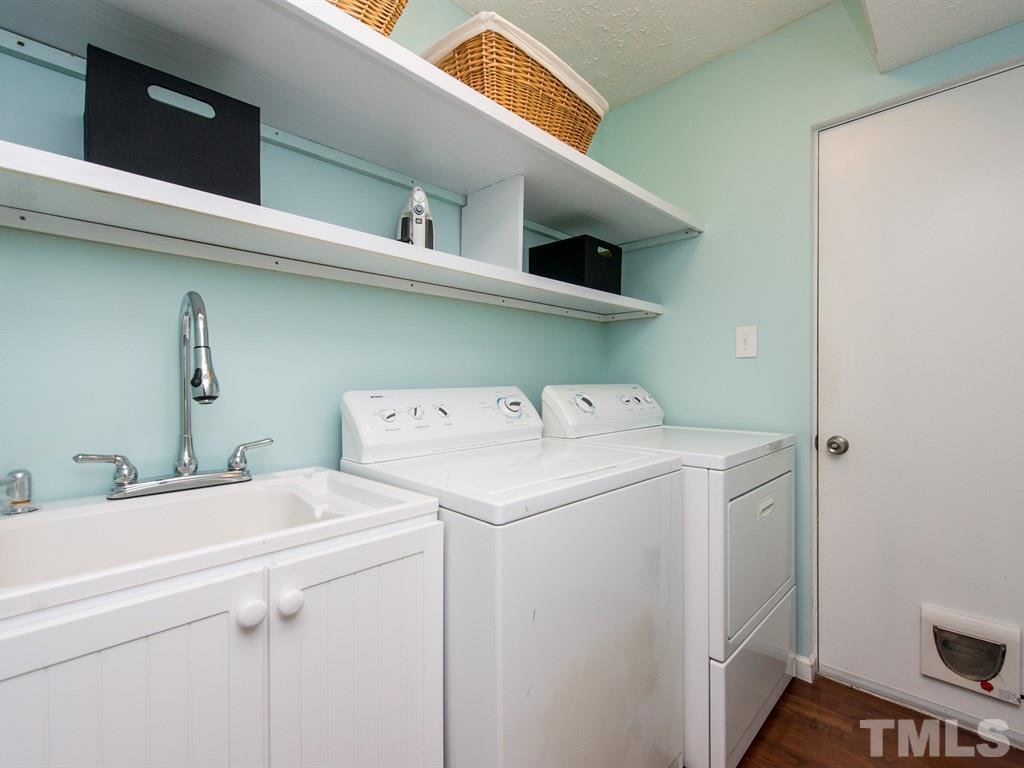 115 Trinity Woods Drive Raleigh, NC 27607 - Photo 21 of 25 a utility room with dryer and washer