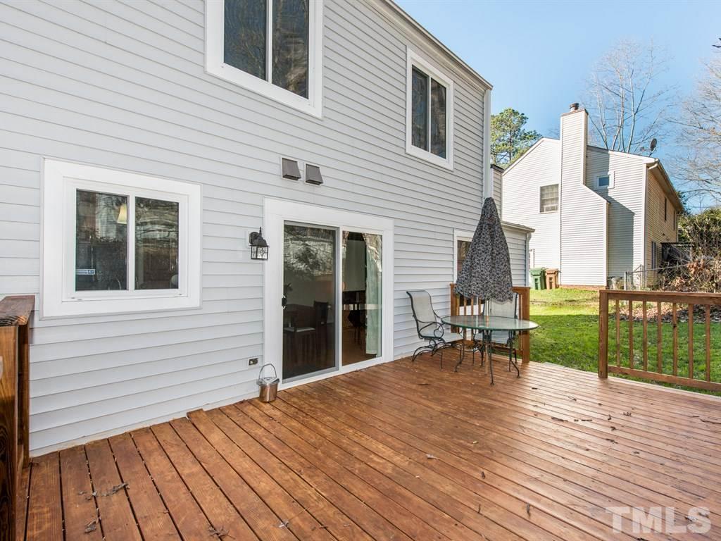 115 Trinity Woods Drive Raleigh, NC 27607 - Photo 22 of 25 a view of a house with lounge chair
