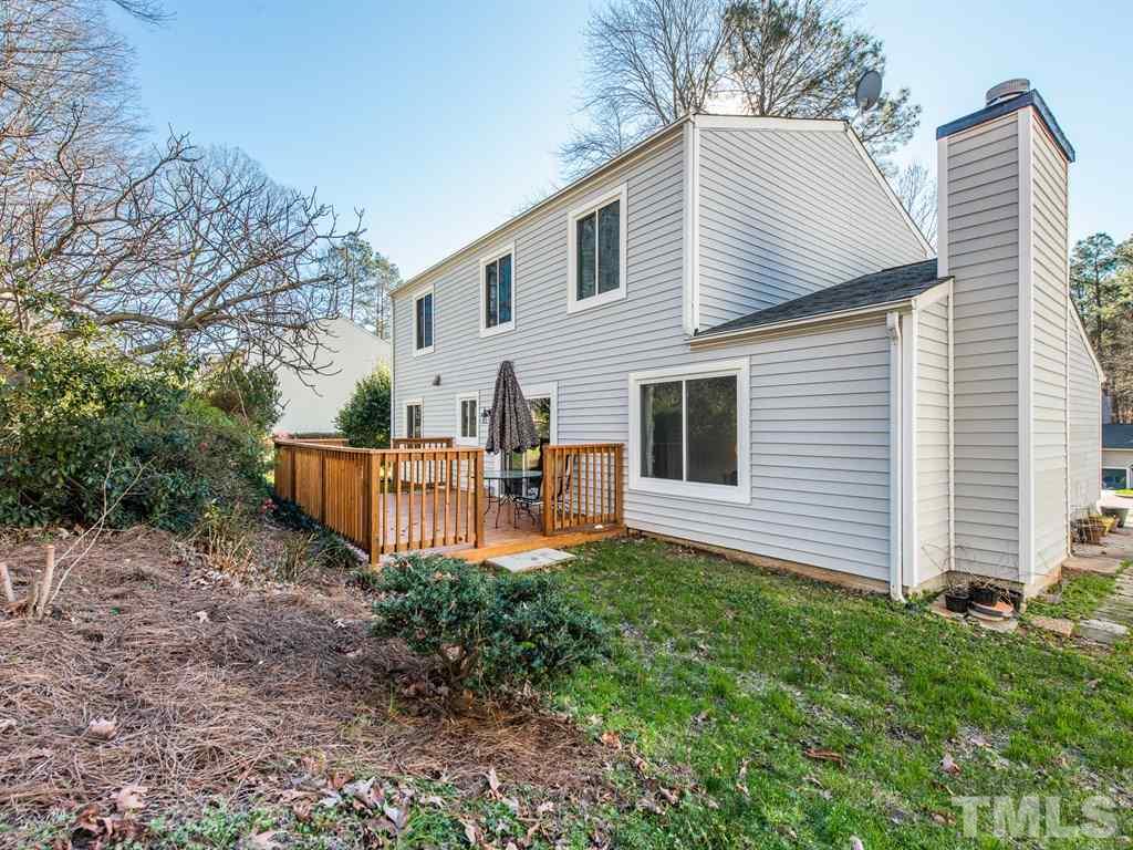 115 Trinity Woods Drive Raleigh, NC 27607 - Photo 23 of 25 a view of a house with backyard and sitting area