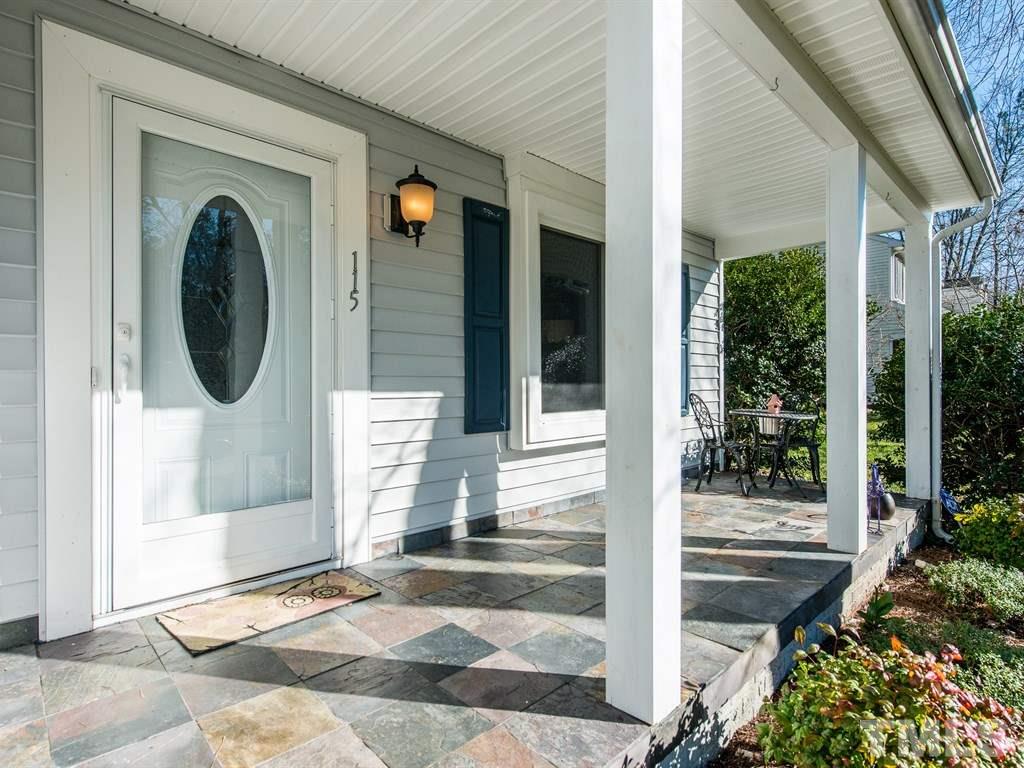 115 Trinity Woods Drive Raleigh, NC 27607 - Photo 25 of 25 a view of a door of a house with a porch