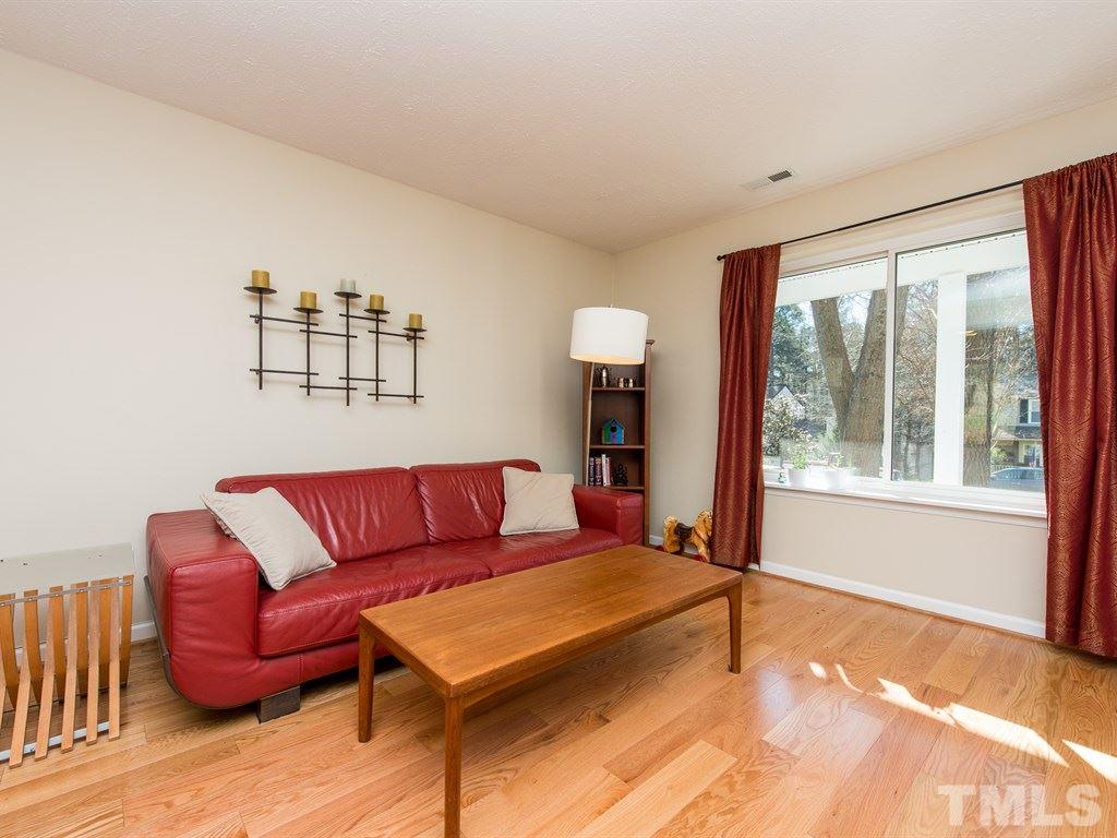 115 Trinity Woods Drive Raleigh, NC 27607 - Photo 8 of 25 a living room with furniture and a window