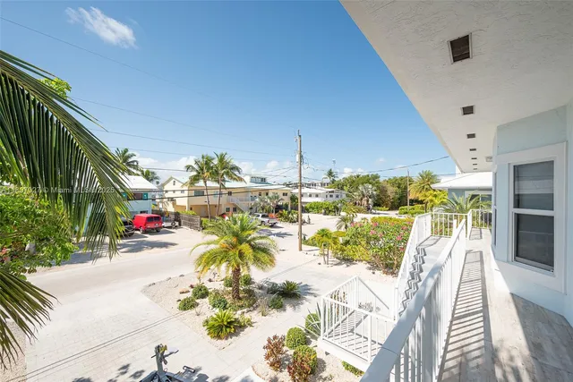 a large kitchen with stainless steel appliances granite countertop a stove and a sink